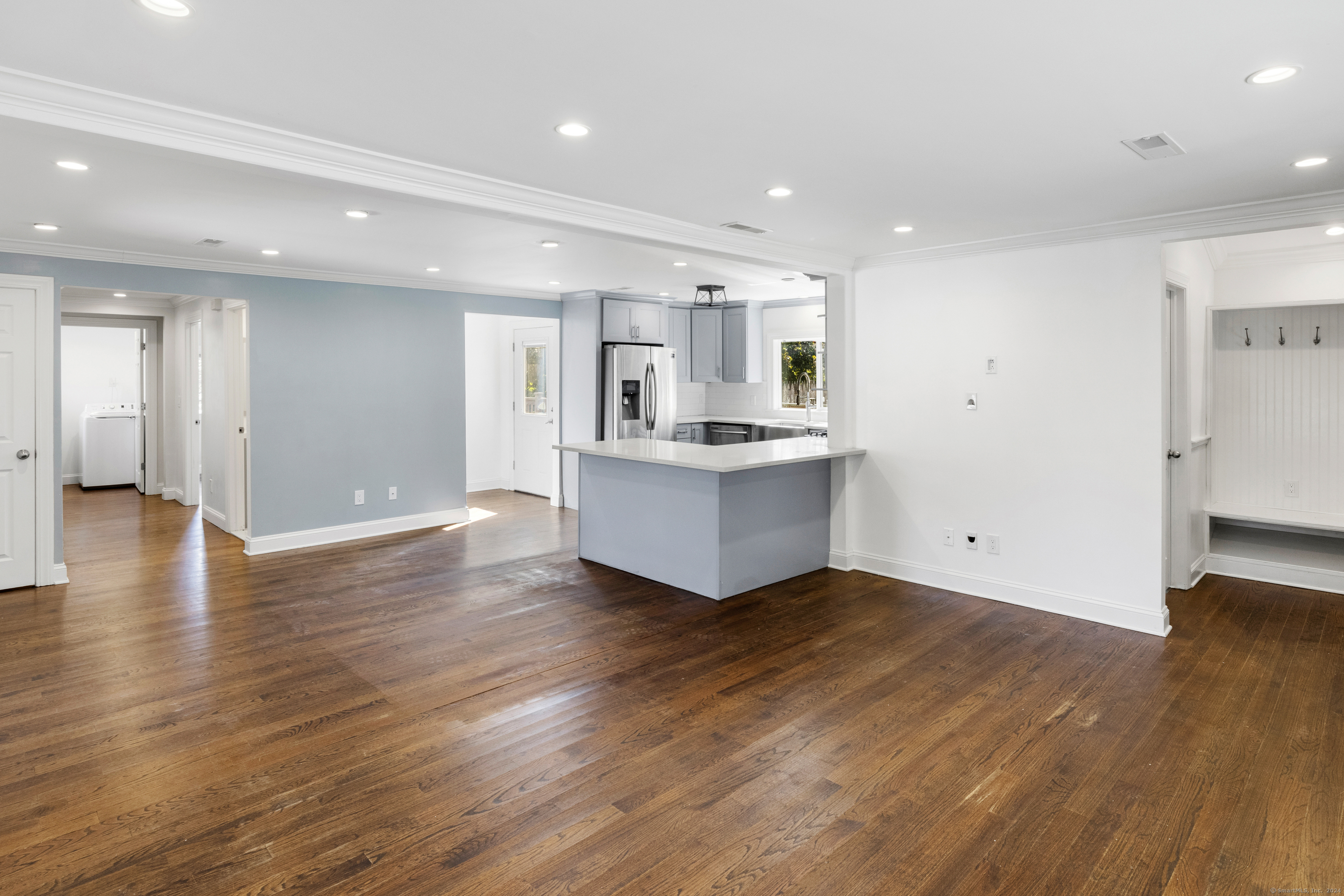 a view of kitchen and wooden floor