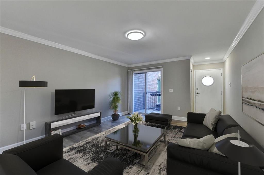 a living room with furniture and a flat screen tv