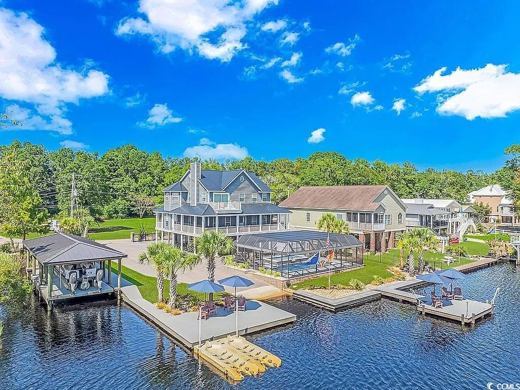 Back of house featuring a water view