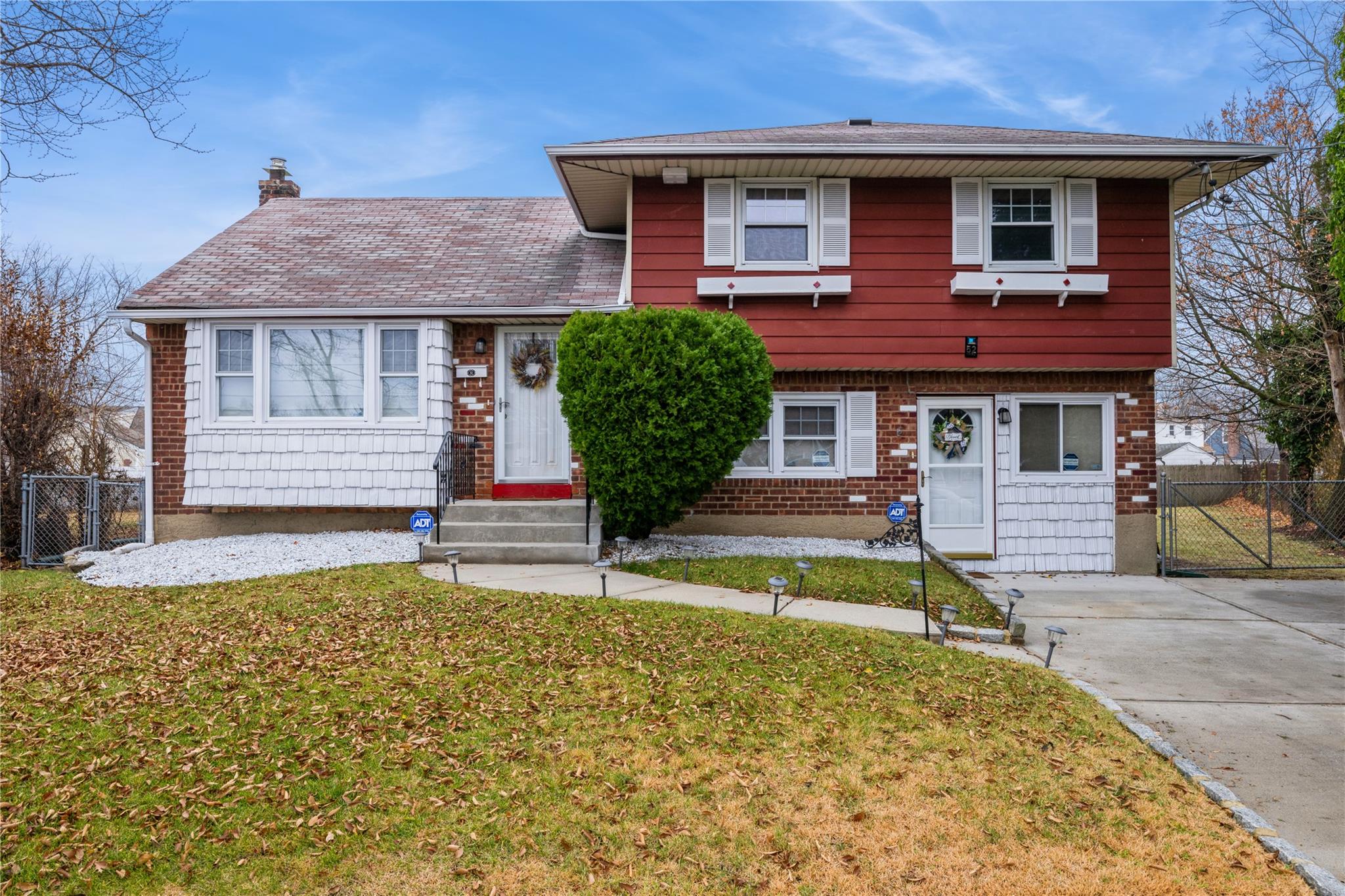 Tri-level home featuring a front yard