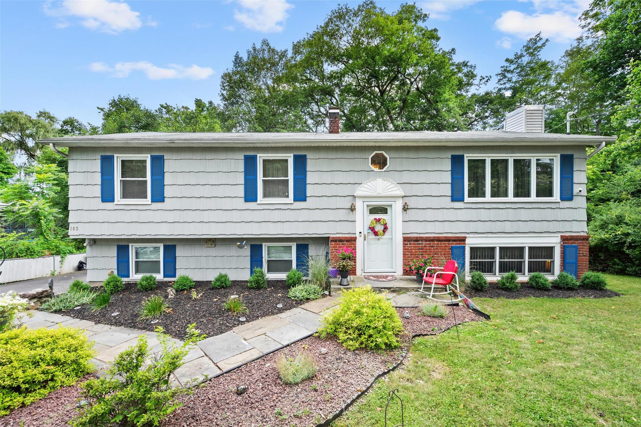 Bi-level home with a front lawn