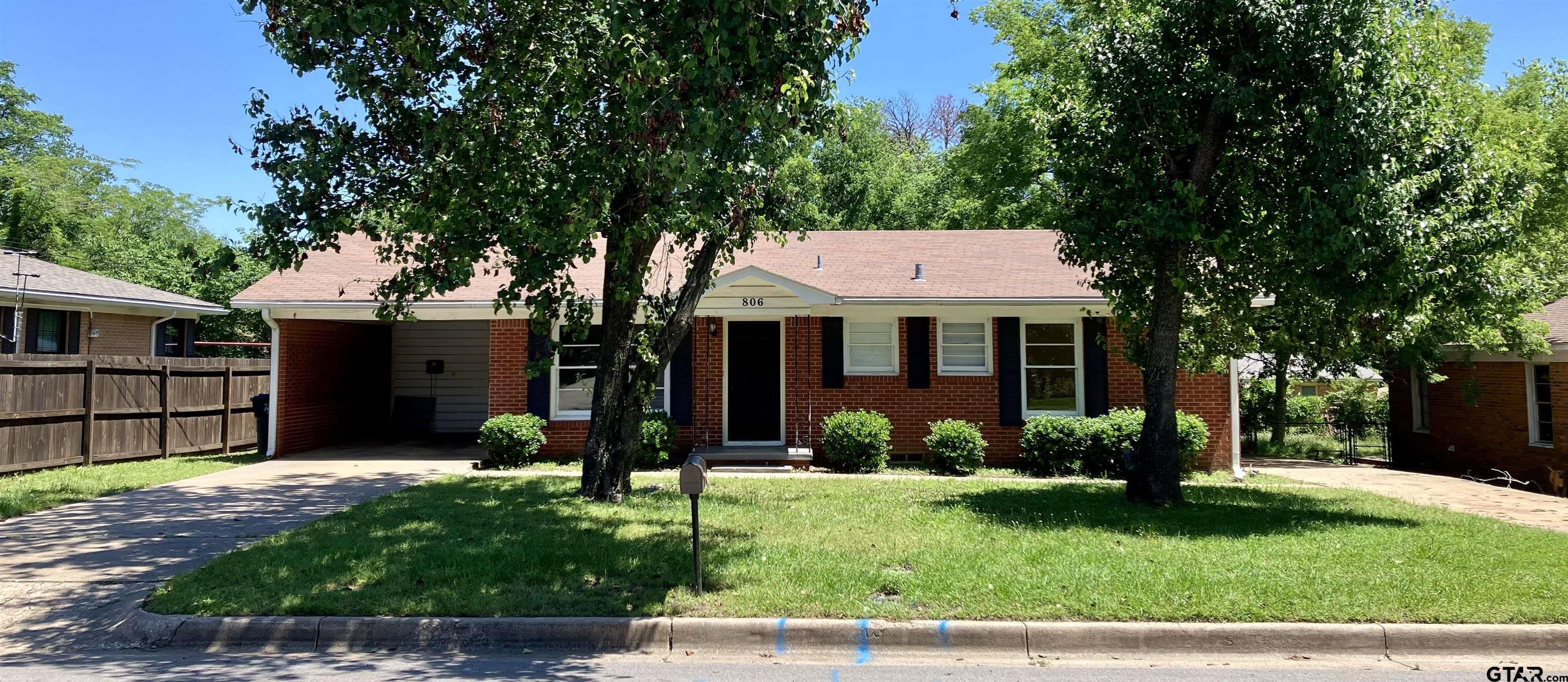 front view of a house with a yard