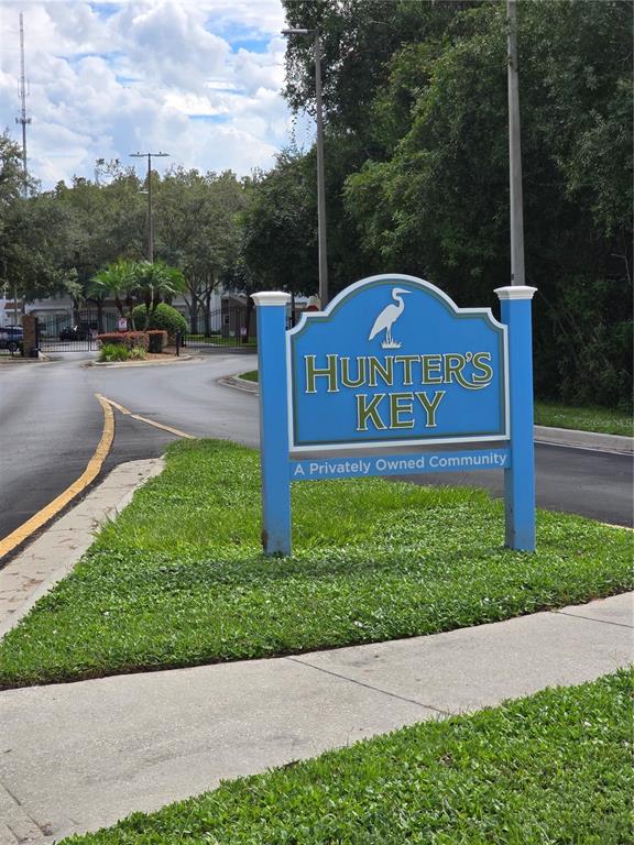 a view of a street with a sign board