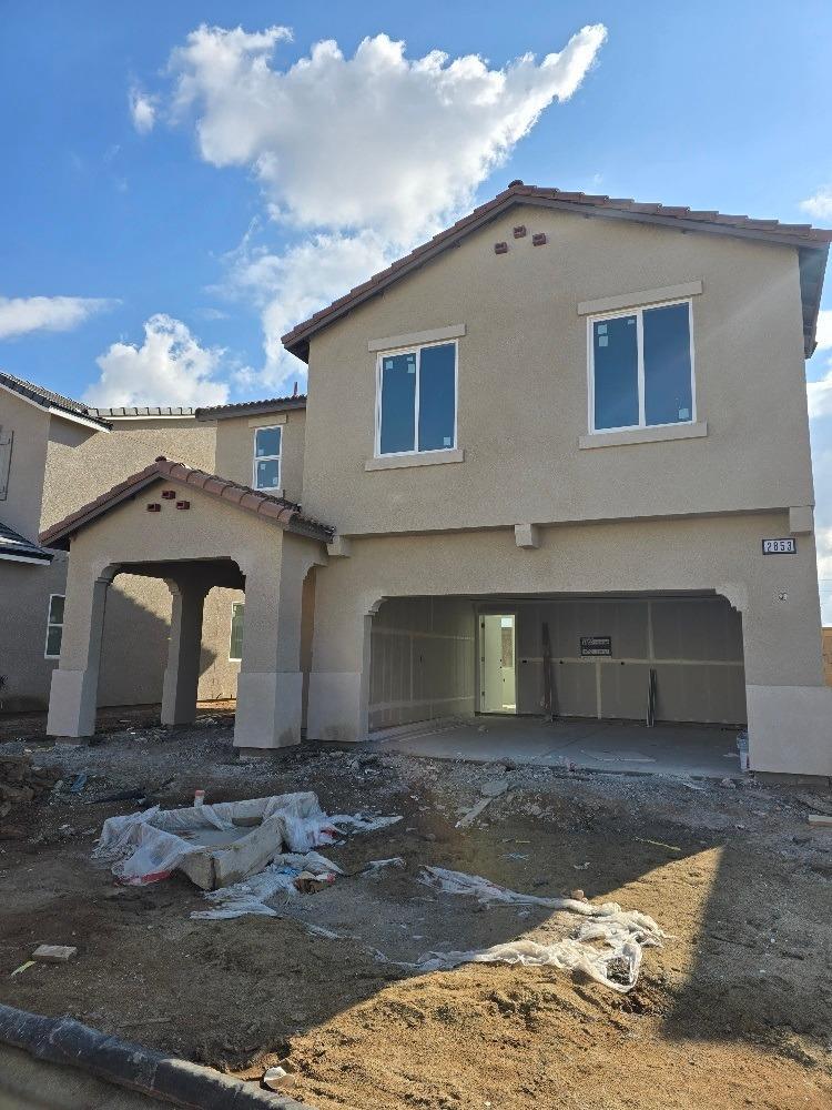 a front view of a house with yard