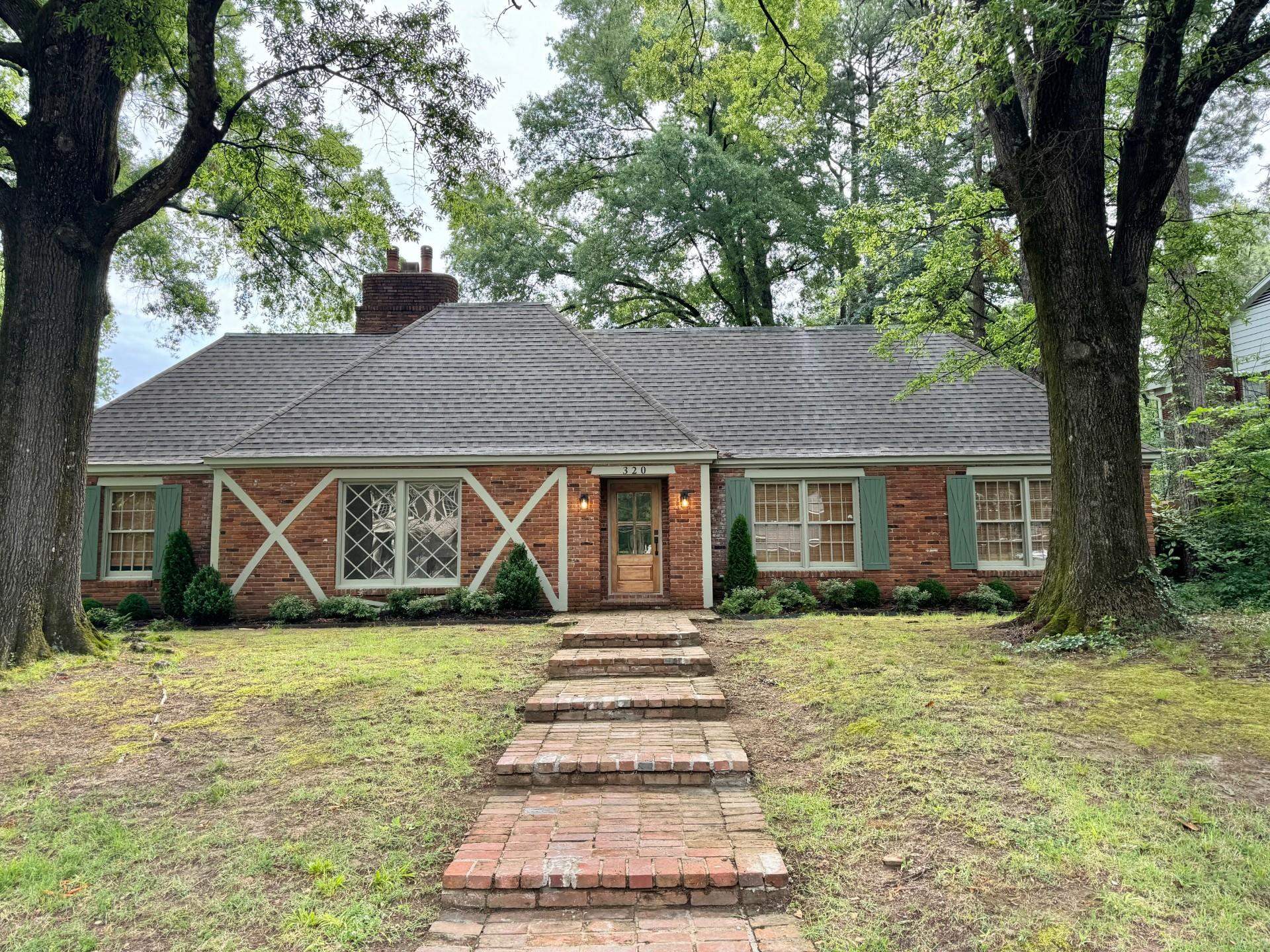 front view of a house with a yard