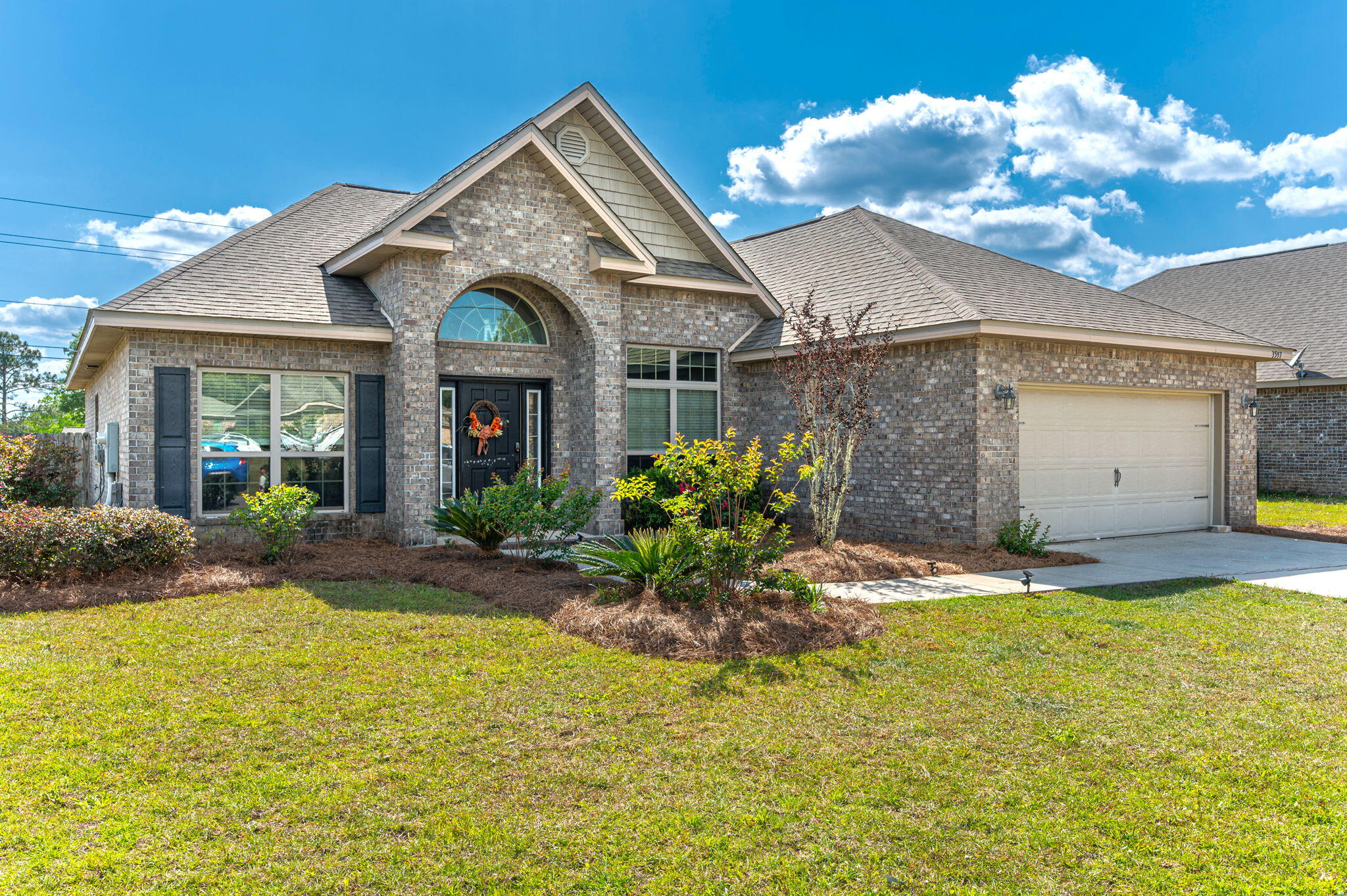 a front view of a house with a yard