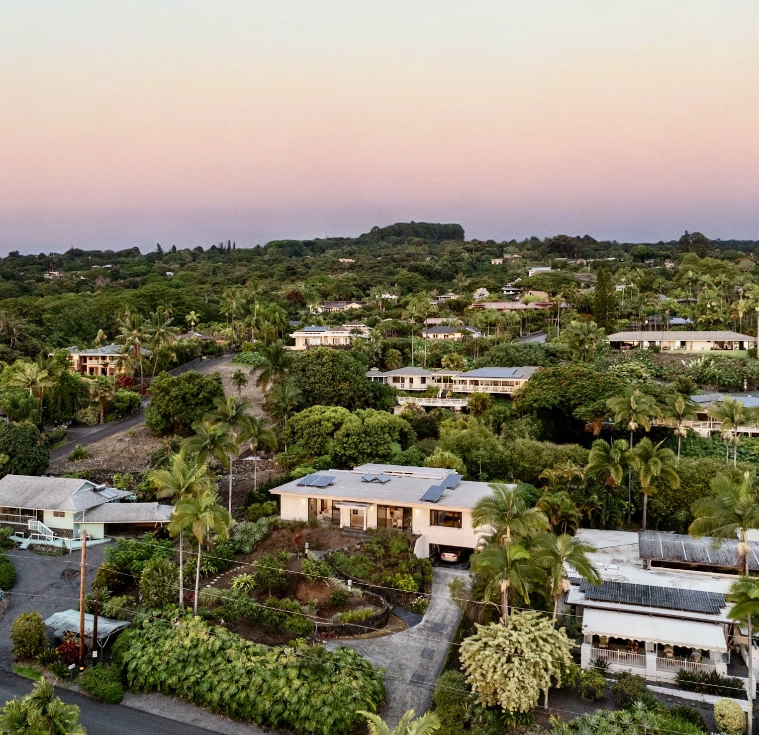 an aerial view of a houses with a lake view