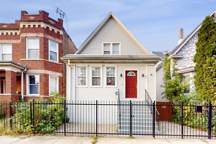 a front view of a house with a porch