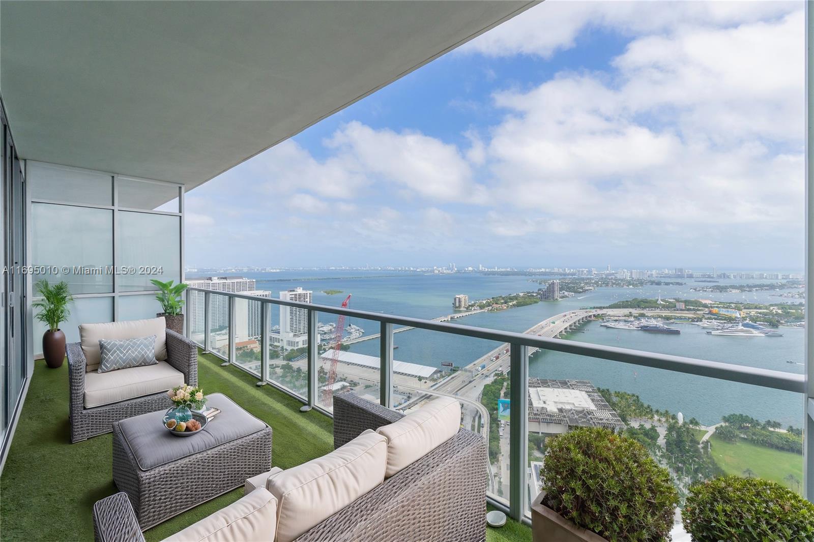 an outdoor living room with furniture