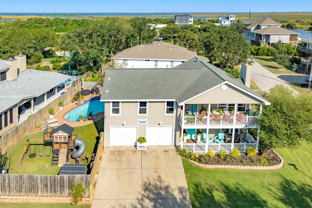 a aerial view of a house with a yard