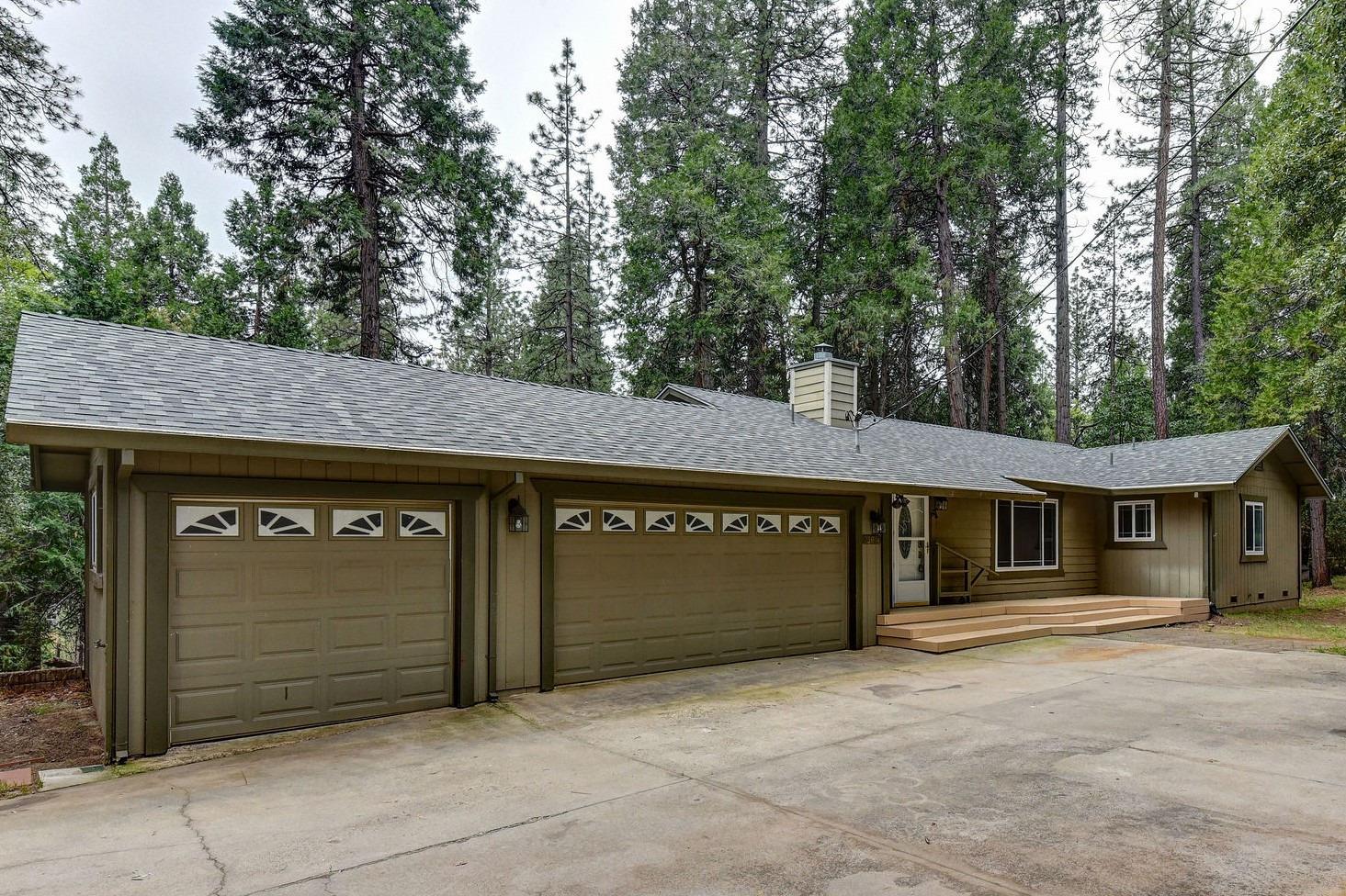 a front view of a building with garage