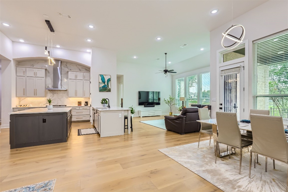 a living room with kitchen island furniture and a kitchen view