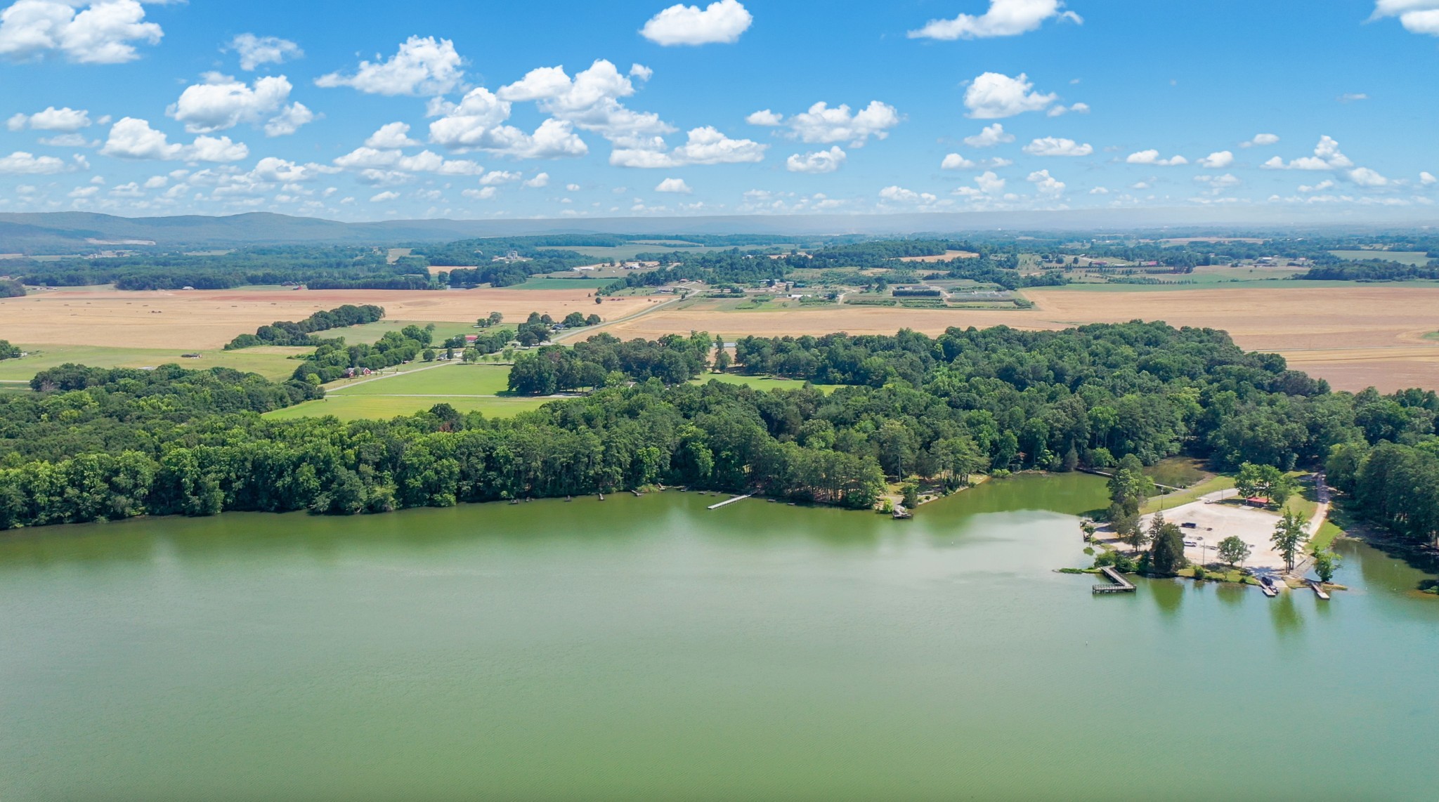 a view of lake with green space