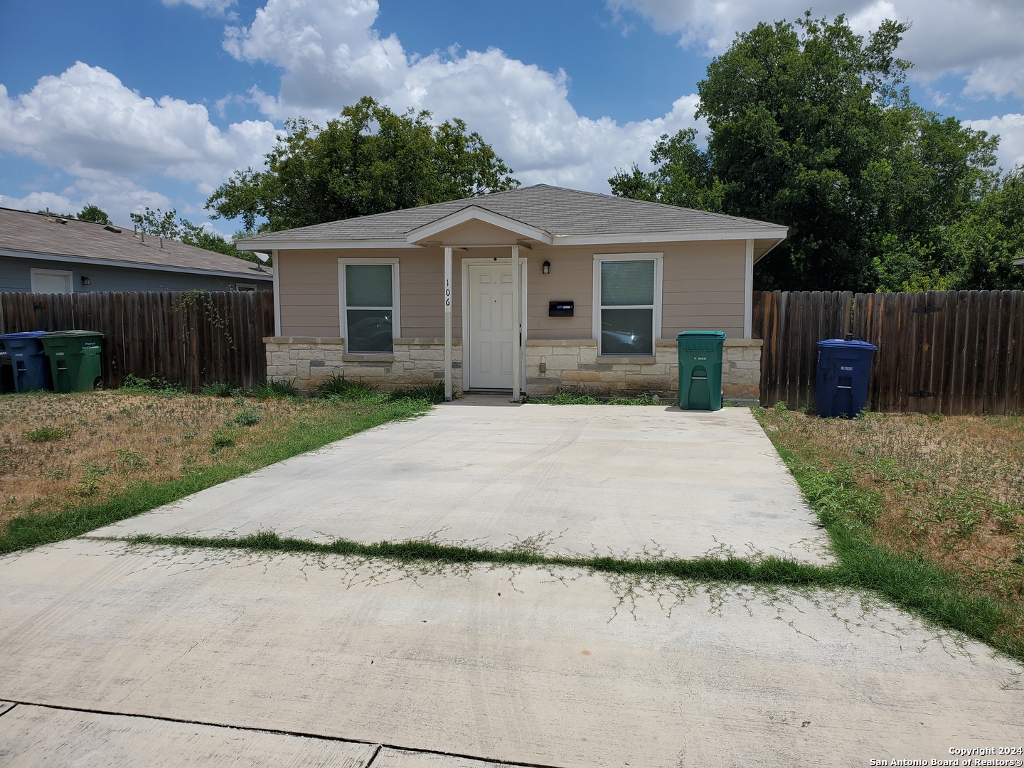 front view of a house with a yard