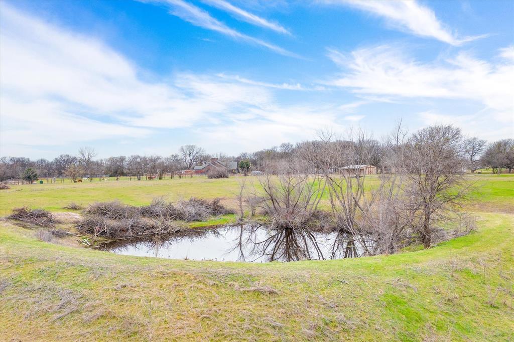 a view of a lake with a big yard