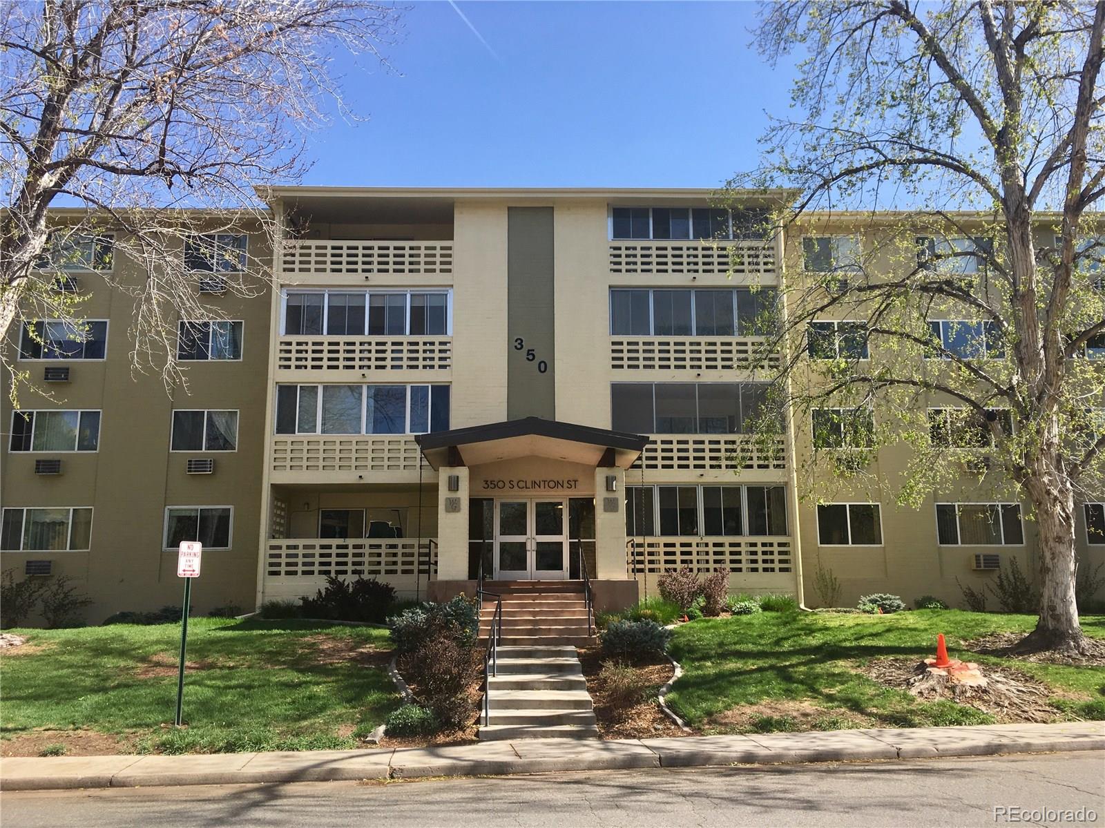 a front view of a building with garden