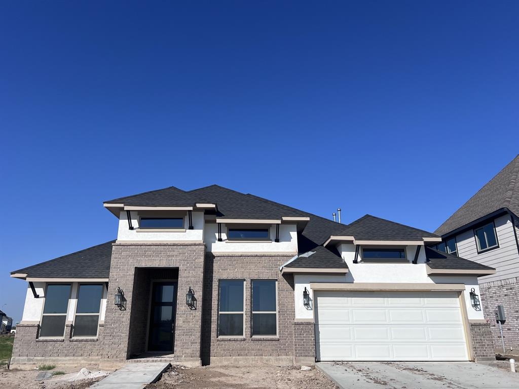 a front view of a house with yard