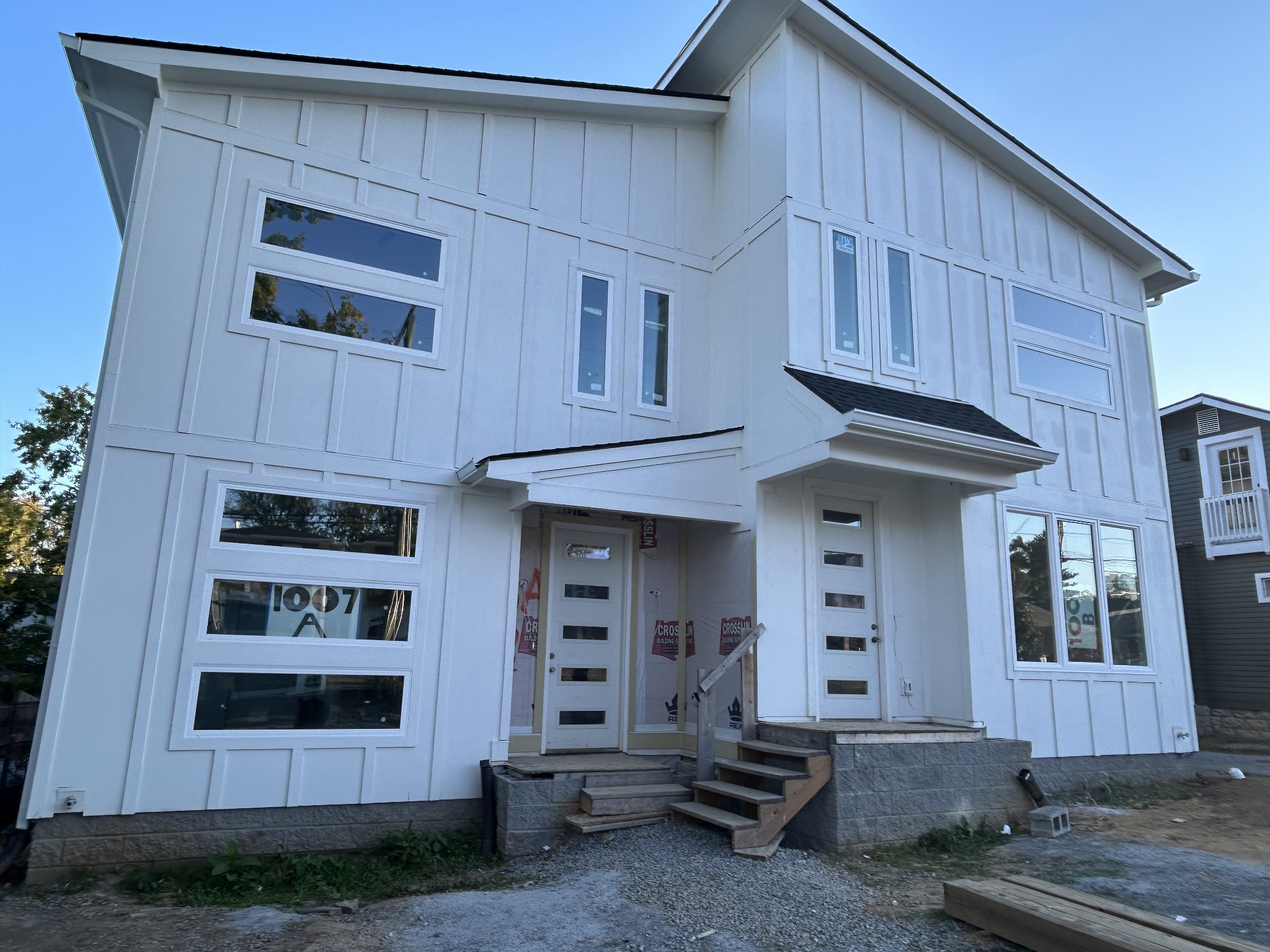 a front view of a house with a garage