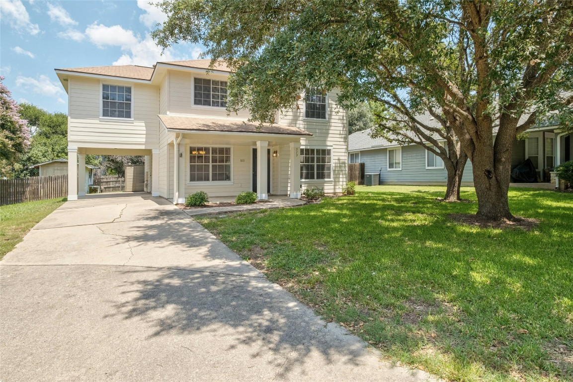 a front view of house with yard and green space