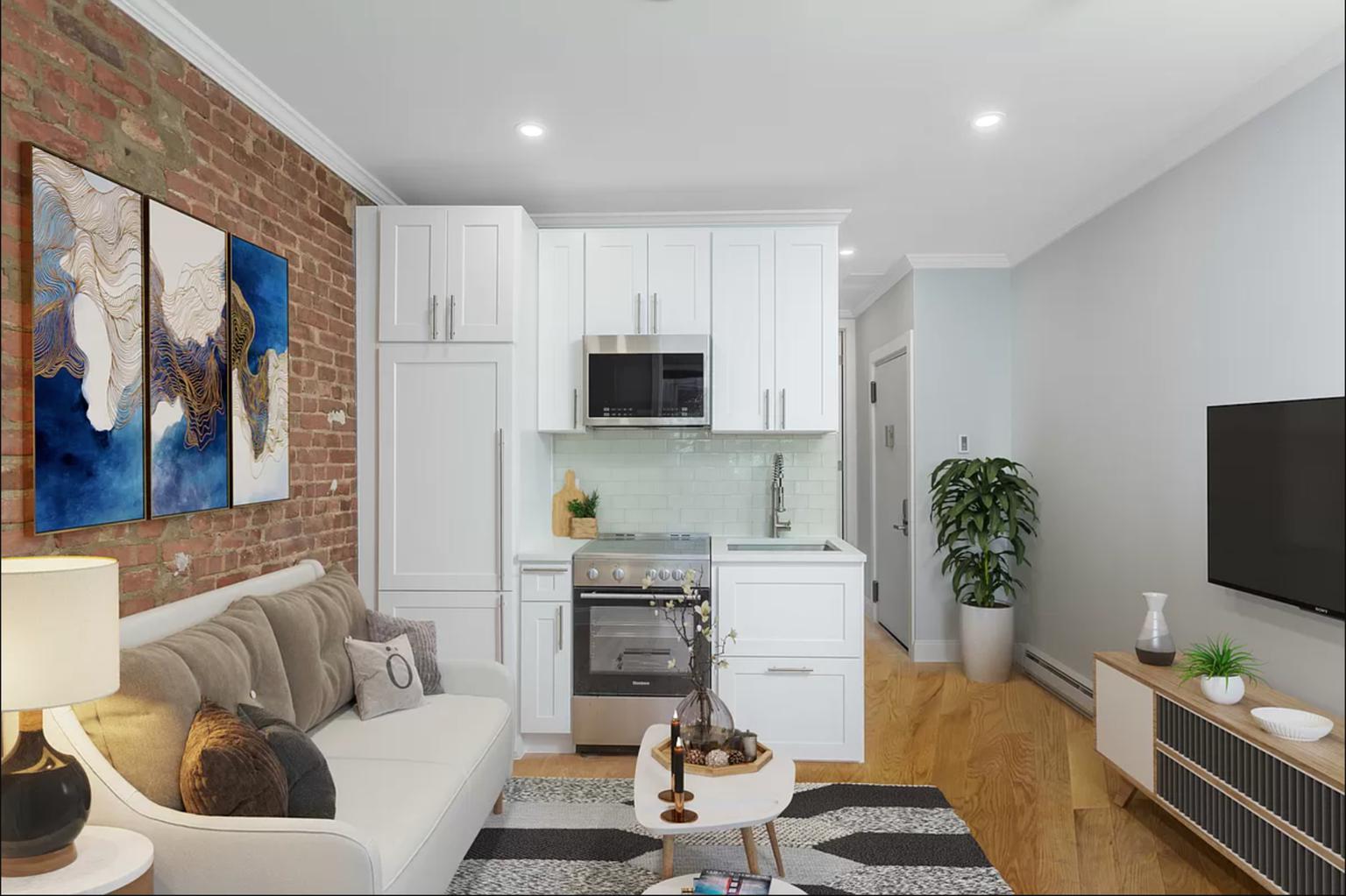 a living room with furniture a flat screen tv and a potted plant