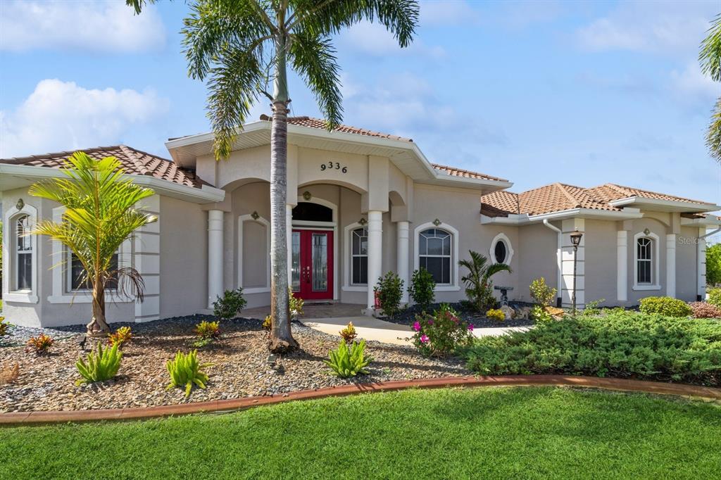 a front view of a house with garden