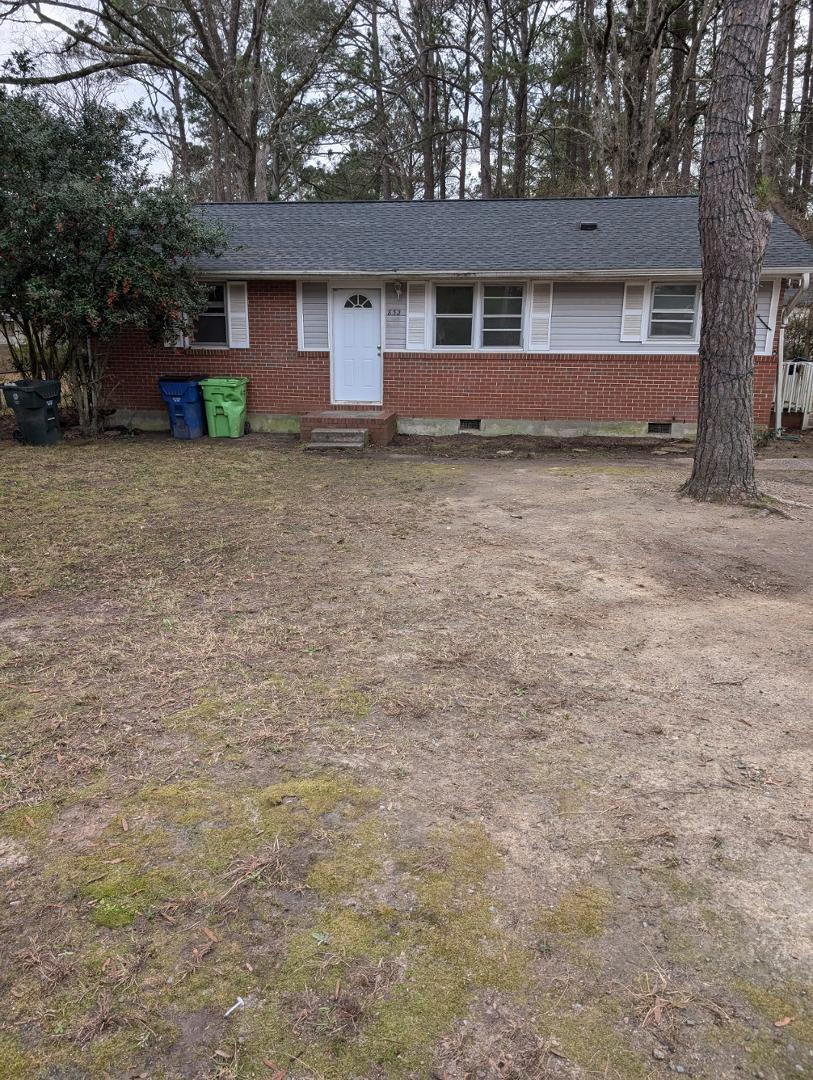 front view of a house with a yard