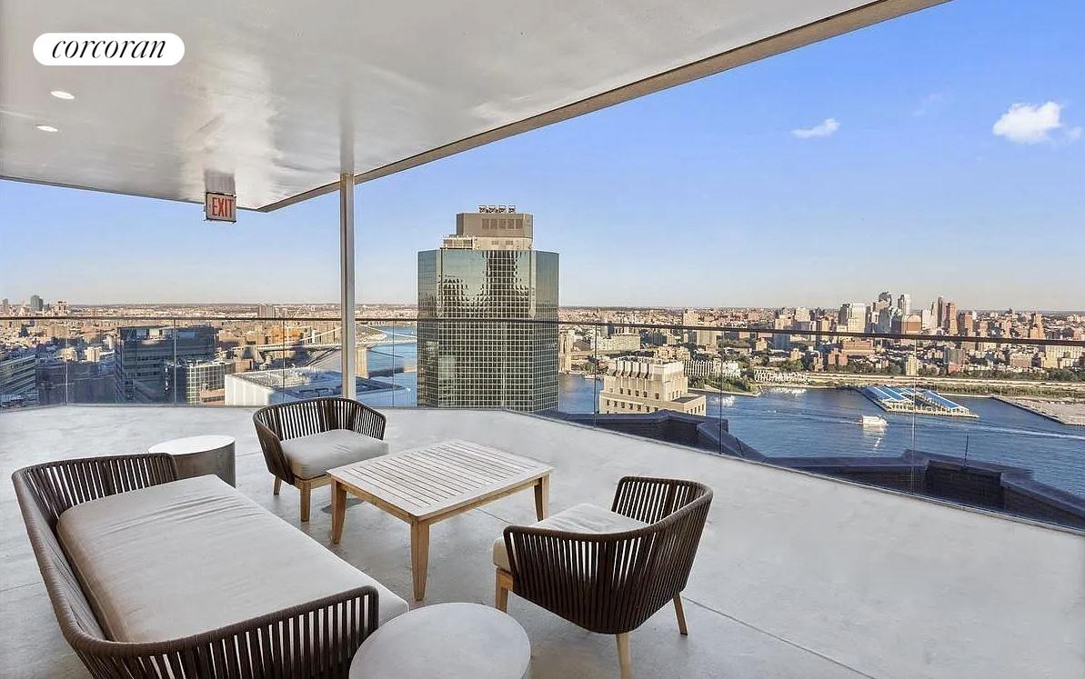 a outdoor living space with furniture and a view of city