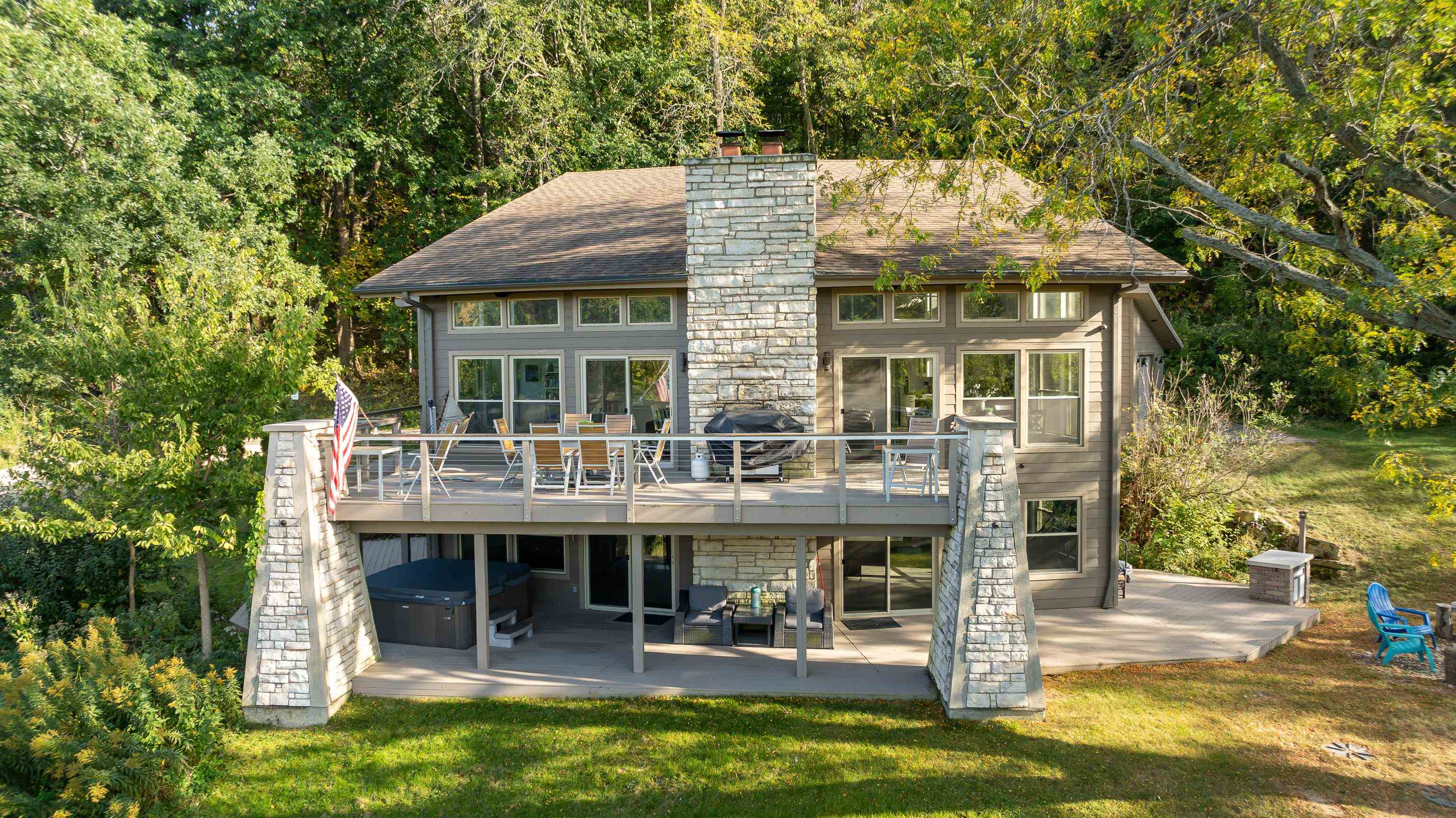 a view of house with swimming pool and porch