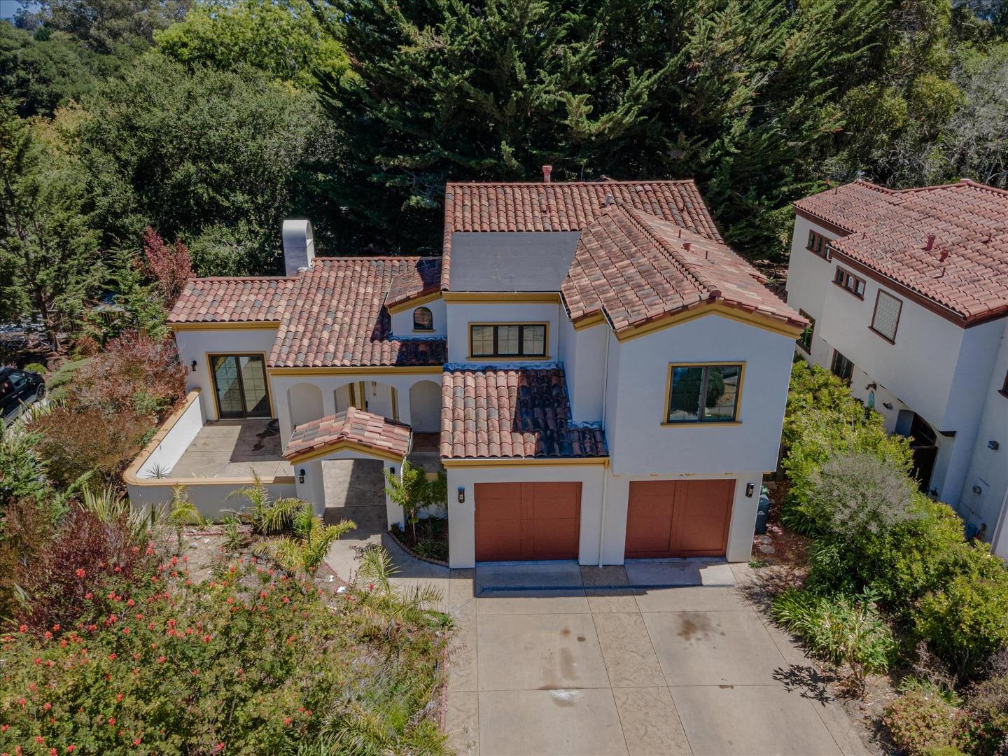 aerial view of a house with a yard