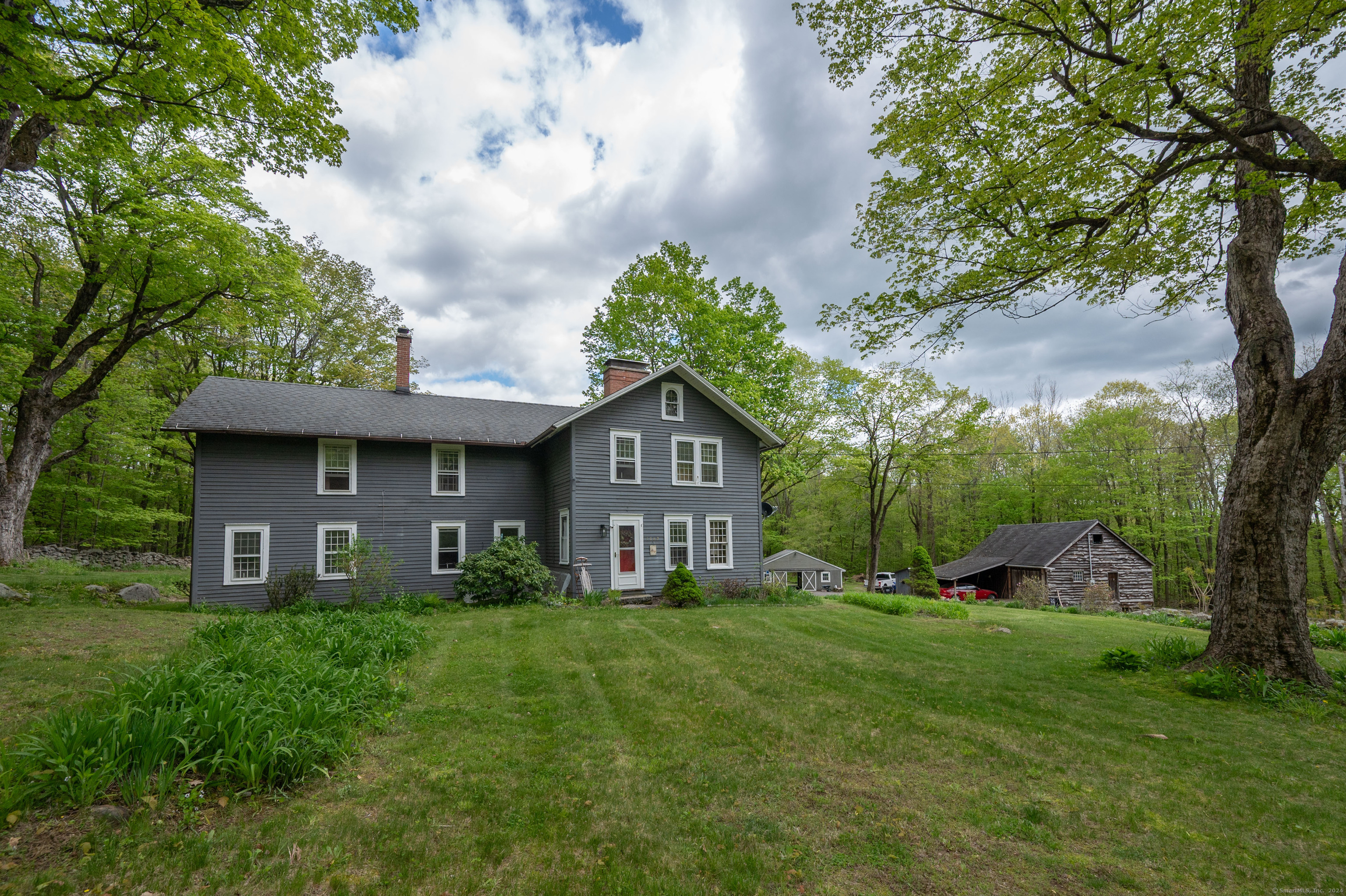 a house view with a garden space