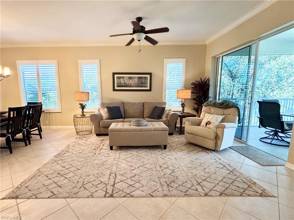 a living room with furniture a large window with outer view