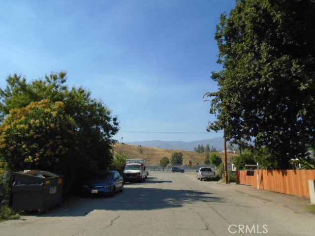 a view of car parked on the roadside