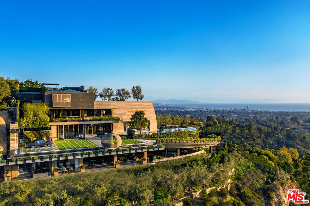 an aerial view of a house with a garden