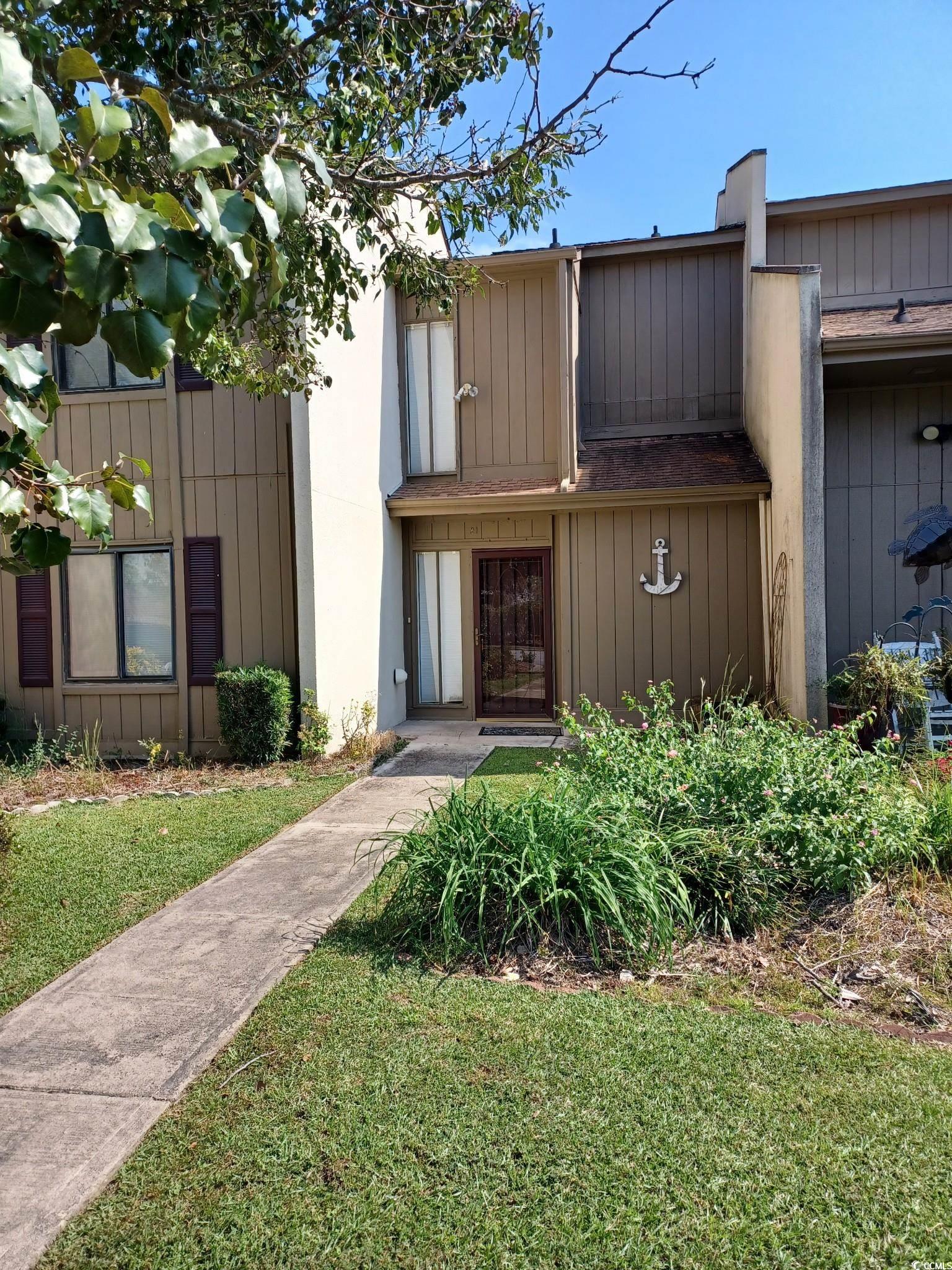 View of front of property with a front lawn