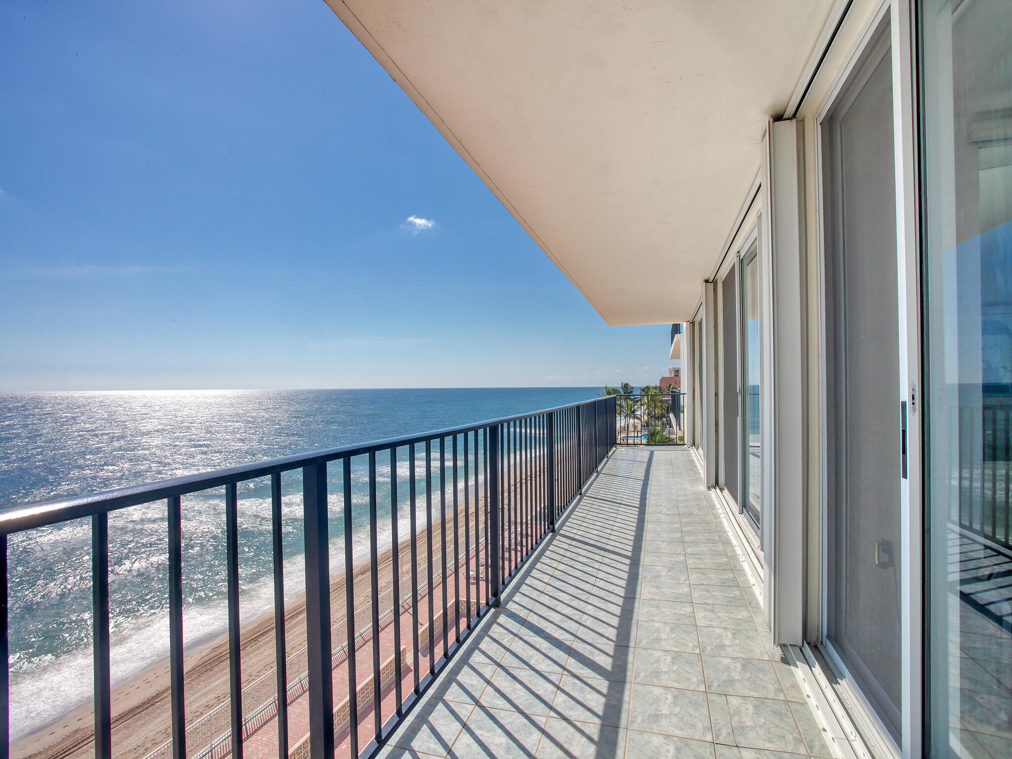 a view of a balcony with wooden floor