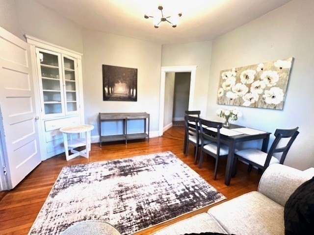 a living room with furniture rug and window