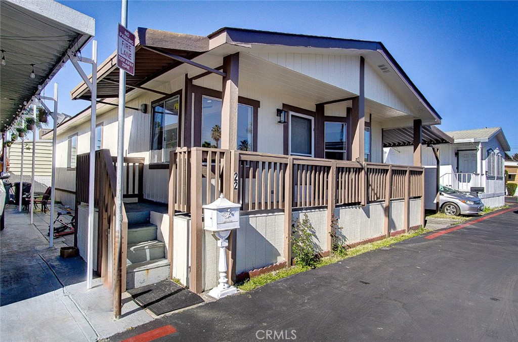 a view of a house with wooden stairs