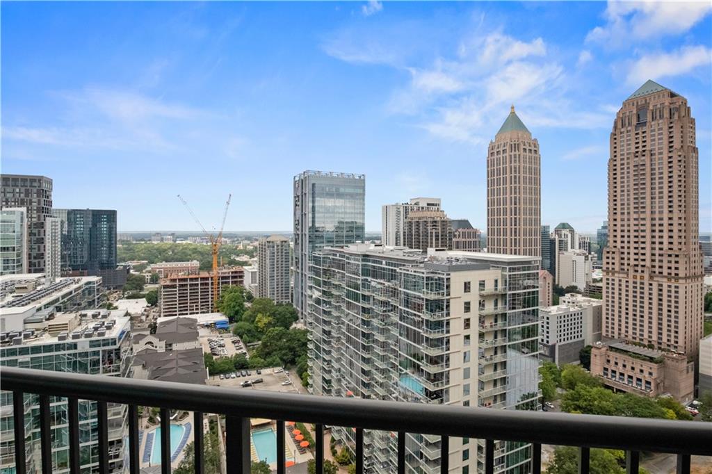 a view of a tall buildings from a balcony