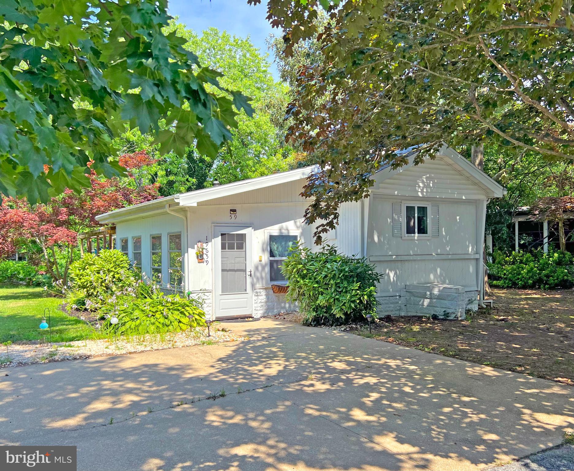 a front view of a house with a yard and a garage