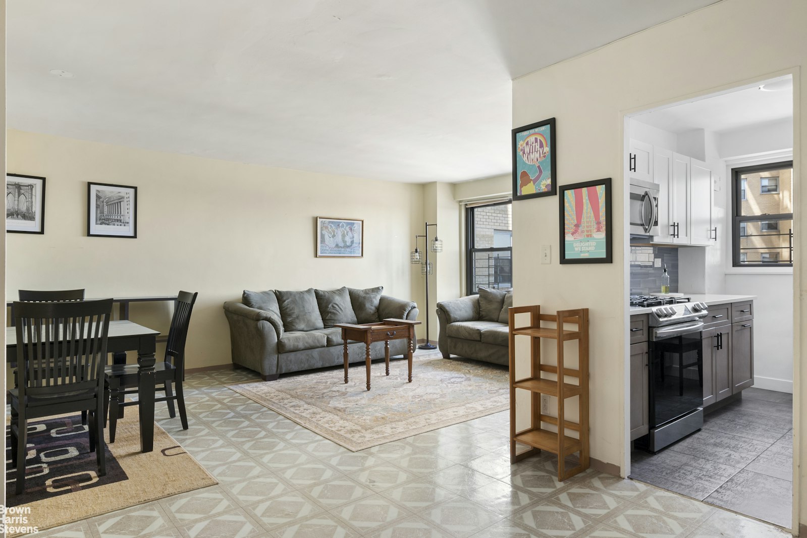 a living room with furniture a flat screen tv and a dining table