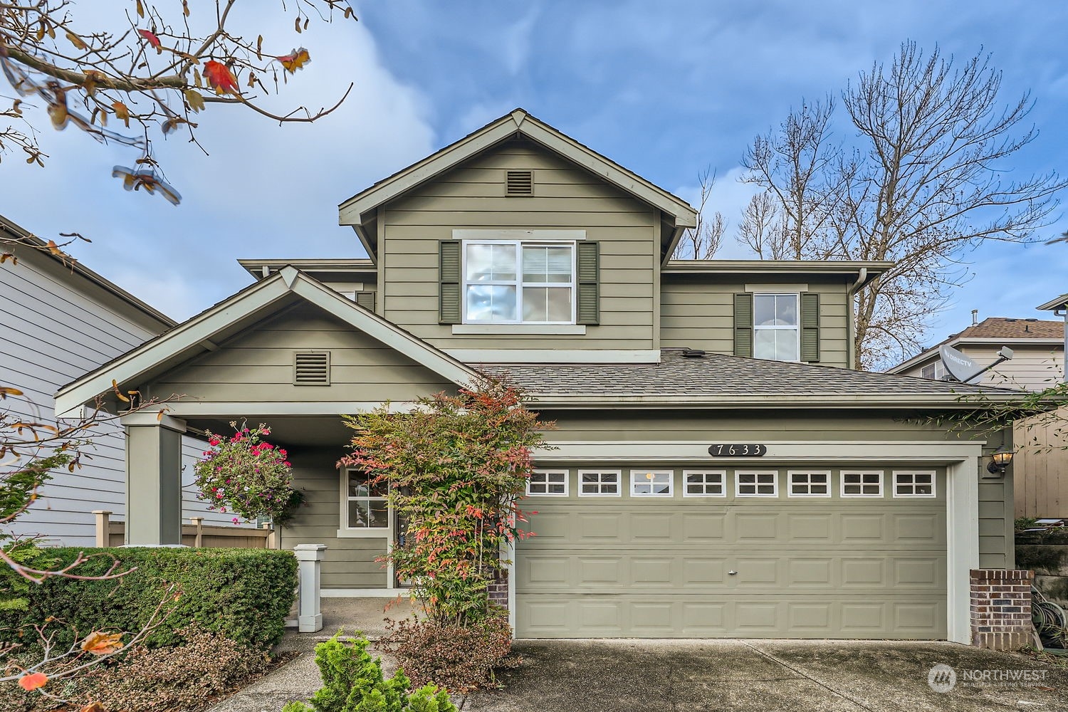 a front view of a house with a garage