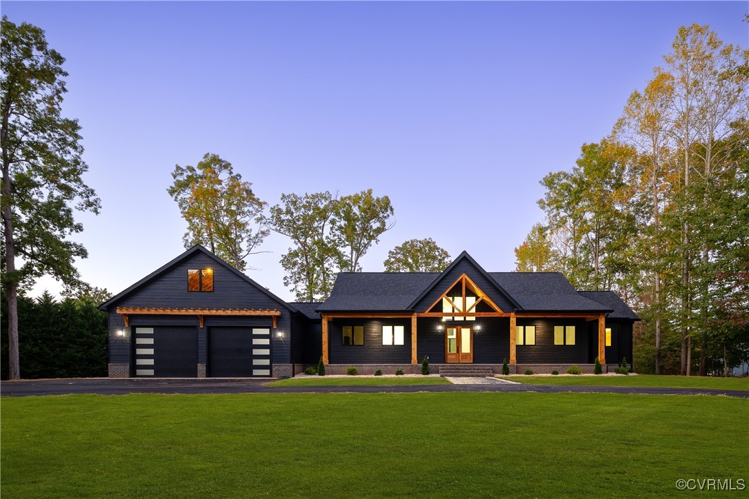 a front view of a house with a garden