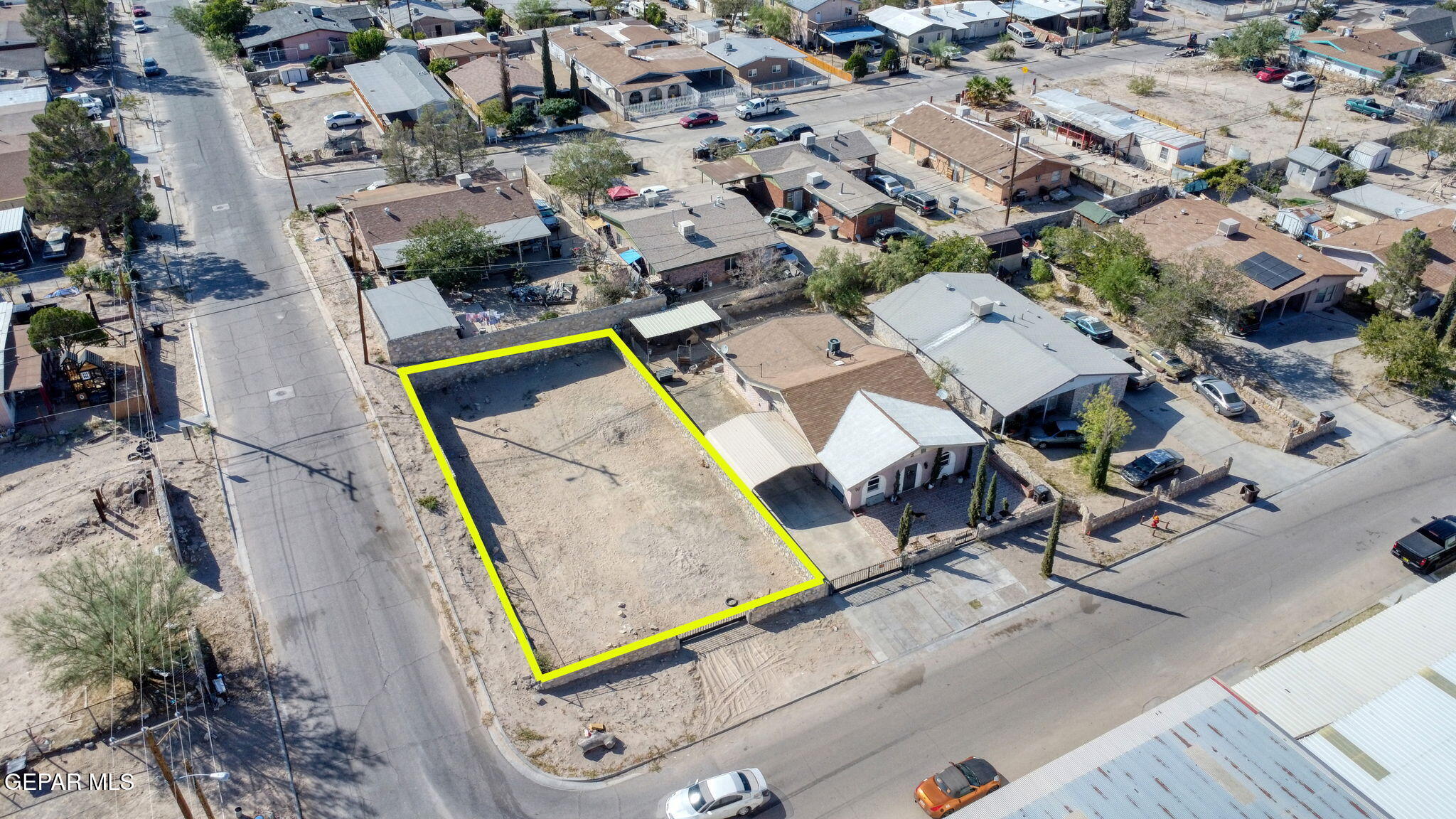 an aerial view of a yard with table and chairs