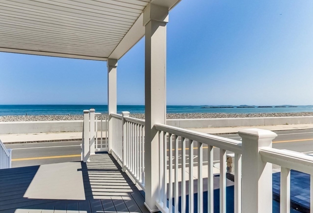 a view of a balcony with an ocean view