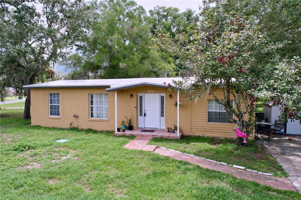 front view of a house with a yard