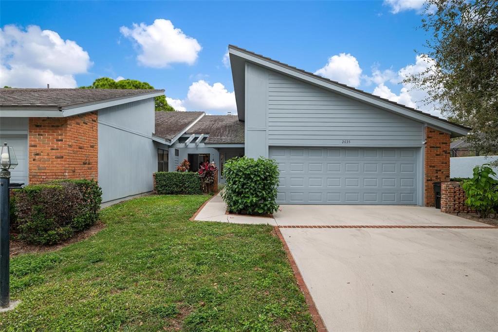 a view of a house with a yard