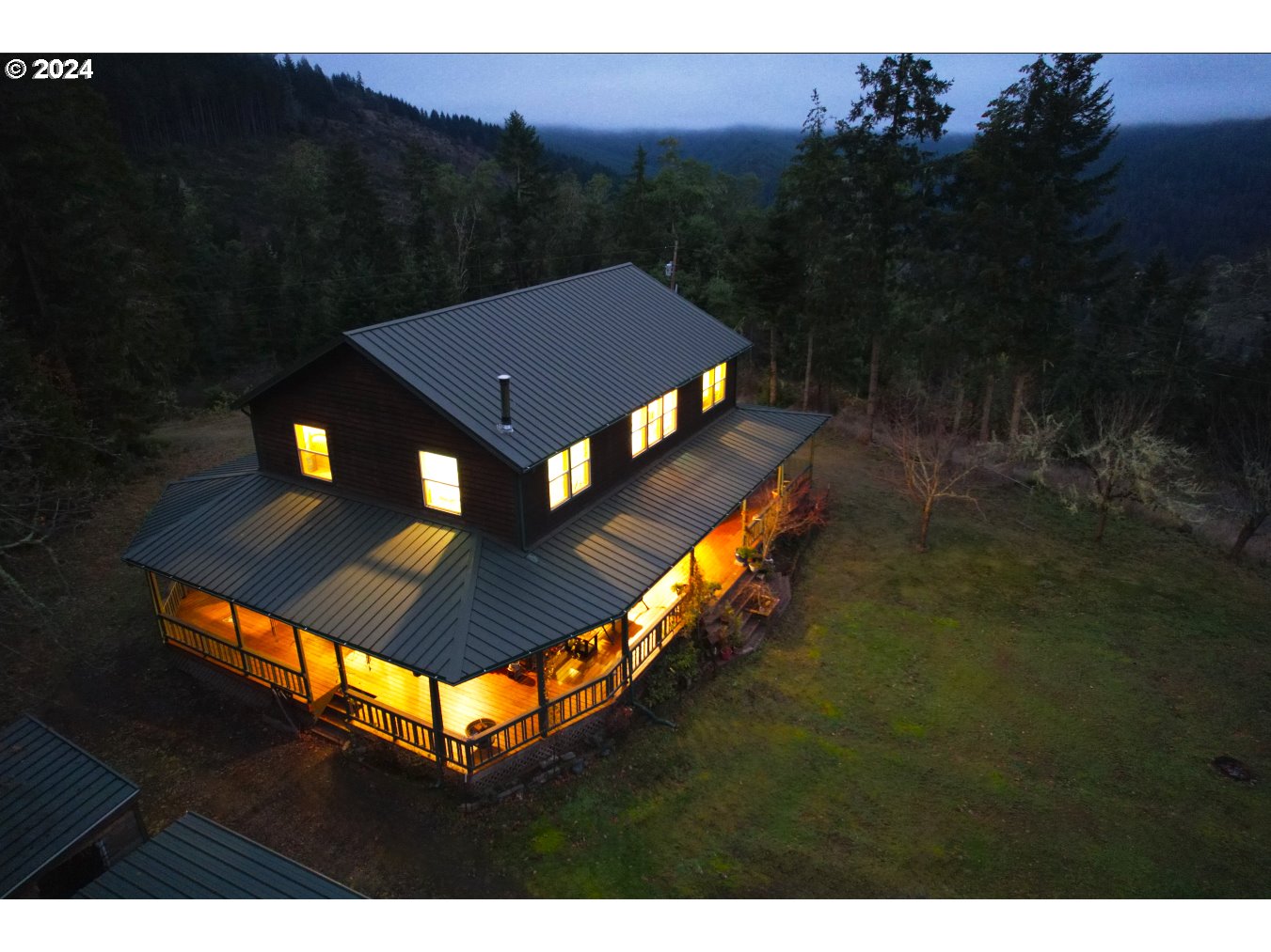 a view of a big house with a big yard