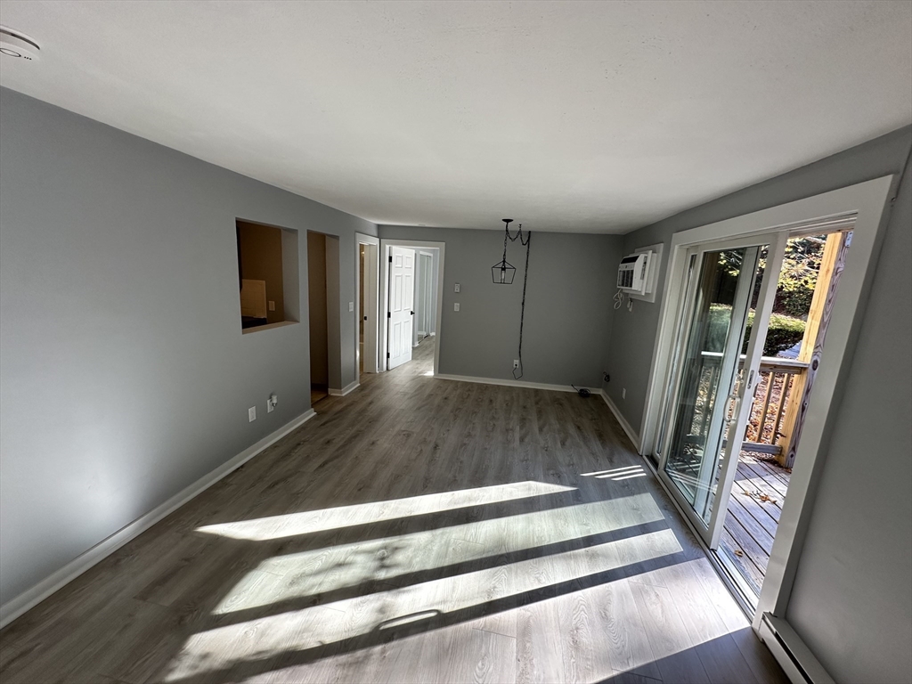 a view of entryway with wooden floor