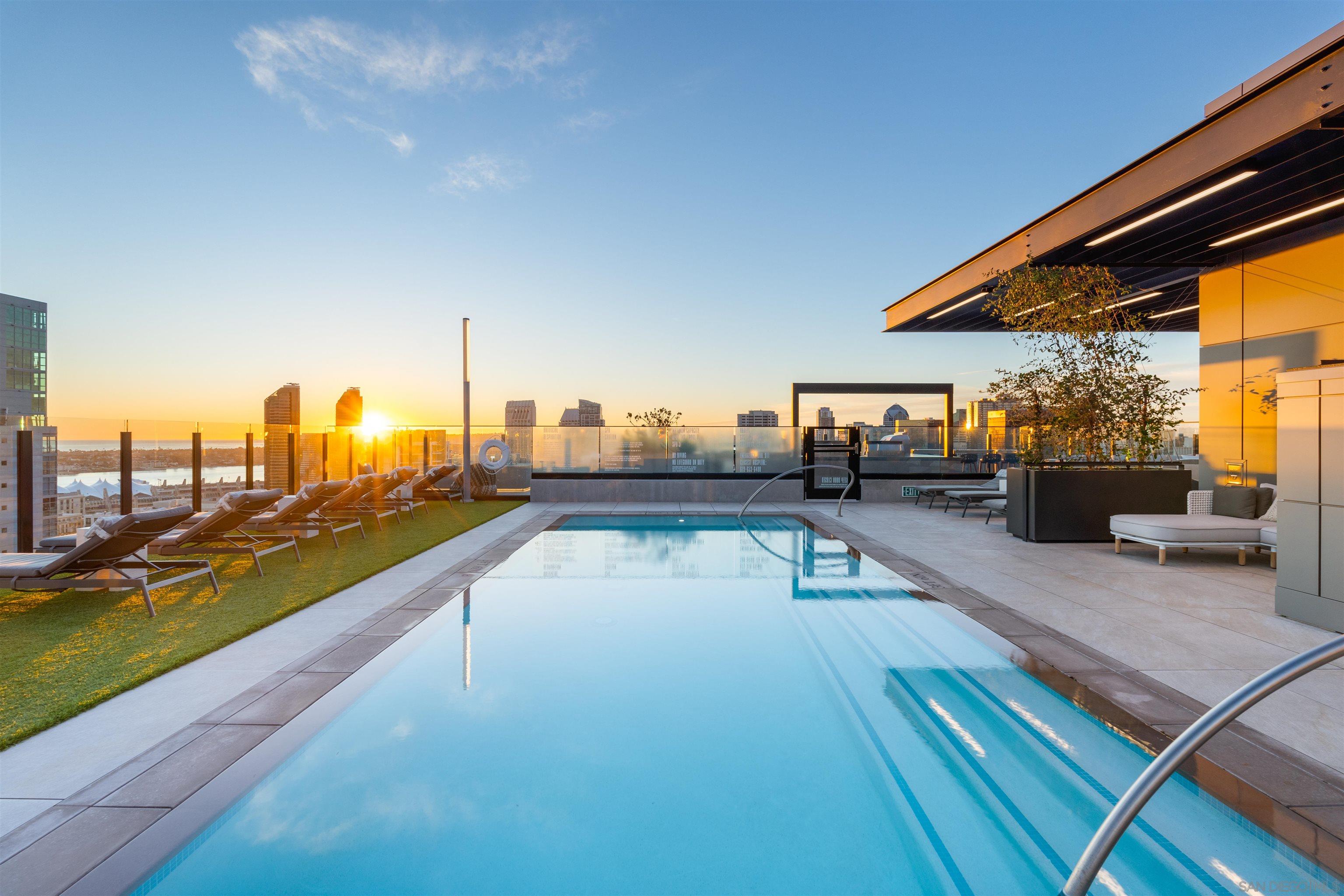 a view of swimming pool with chairs