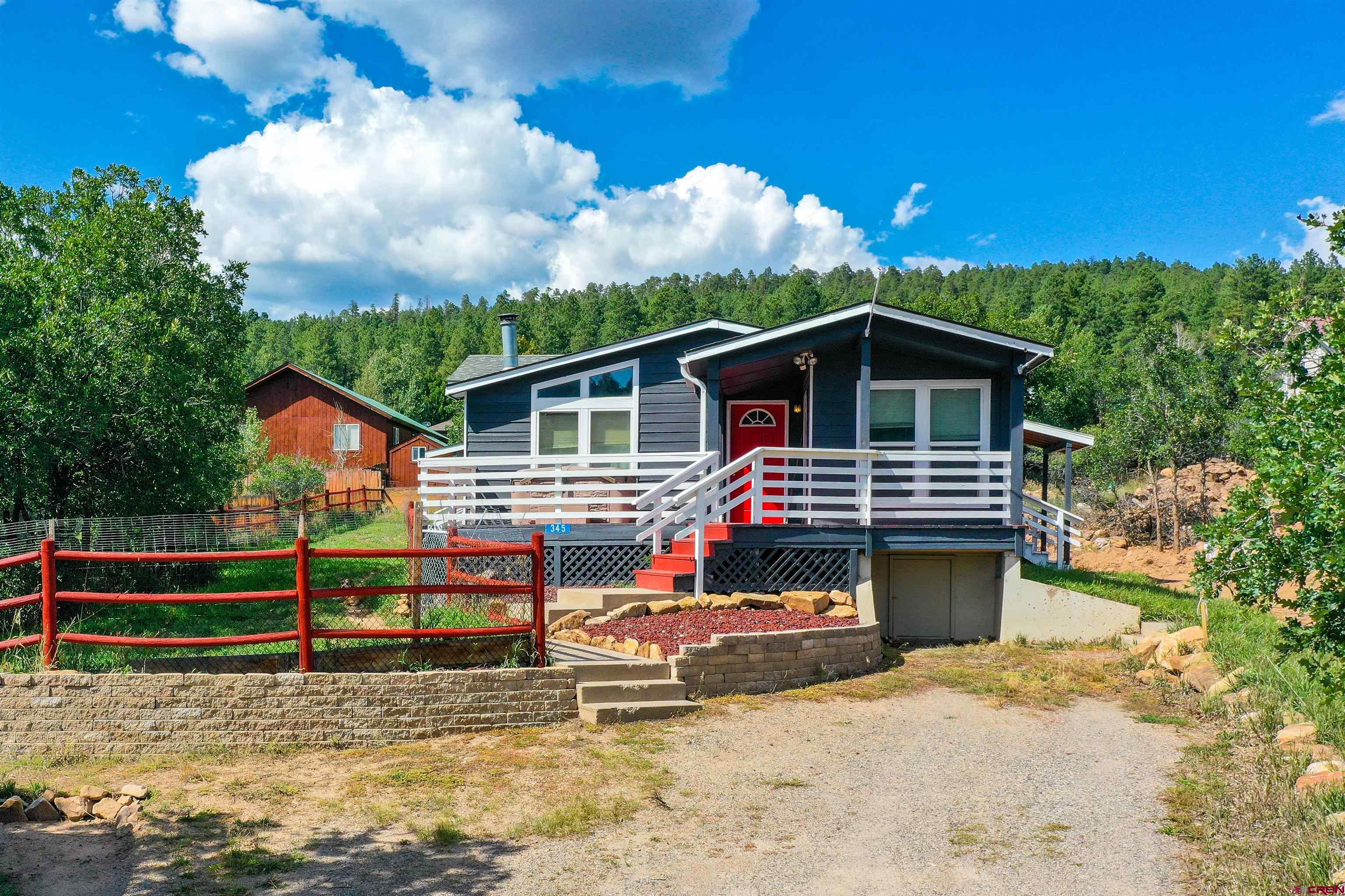 a view of house with swimming pool and outdoor space